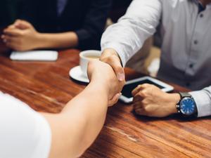 Close up of people shaking hands