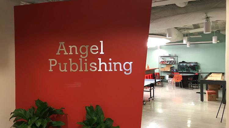Inside Angel Publishing S Downtown Baltimore Office Angel Publishing S Logo Is Displayed Outside Of The Recreational Area