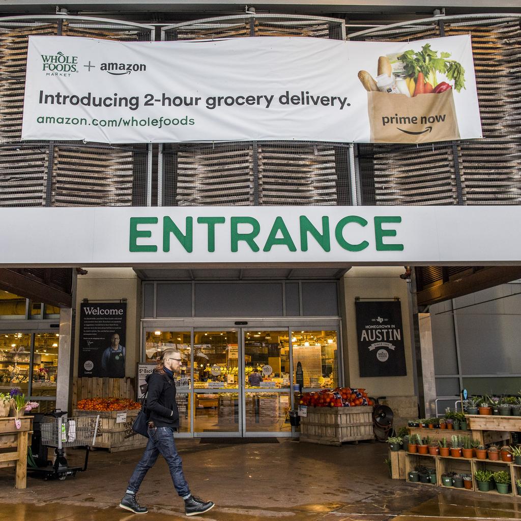 is buying more than groceries with Whole Foods — it's also getting  more than 400 stores to use as delivery hubs - Vox