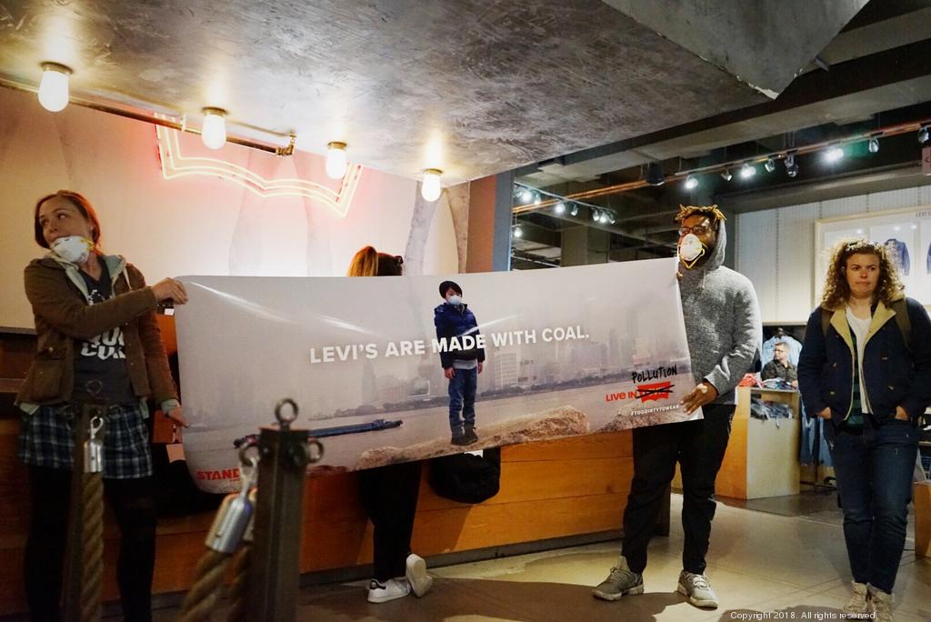 Activists gather in Times Square to protest Levi Strauss - New