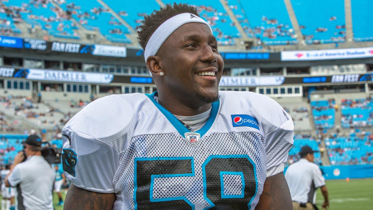 Carolina Panthers linebacker Thomas Davis lifts the NFC