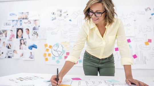 Woman drawing a business plan