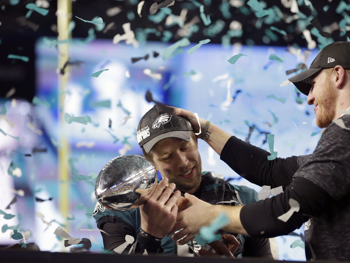 Eagles quarterback NICK FOLES raises the Lombardi Trophy