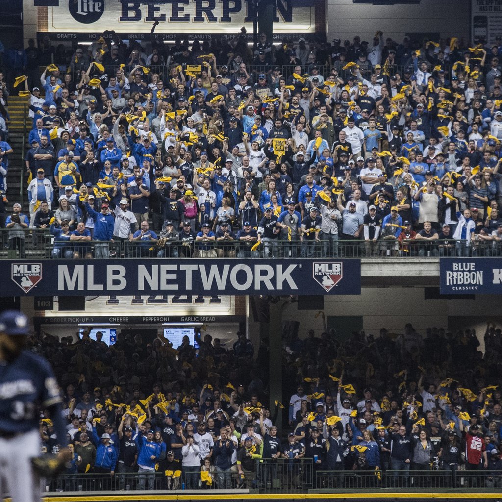 Milwaukee Brewers fans interact with Brat, one of the five popular