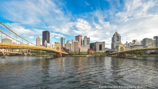 Roberto Clemente bridge and Andy Warhol bridge spanning over the Allegheny river with Pittsburgh skyline on background, Pennsylvania, USA