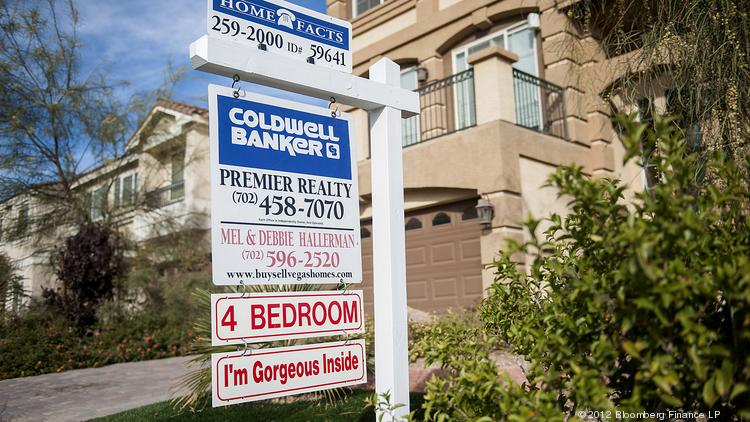 A Coldwell Banker LLC sign is displayed outside of a house for sale. Photographer: Jacob Kepler/Bloomberg