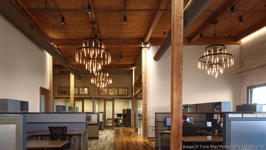 Workstations with View of Glass Offices and Industrial Iron Chandeliers