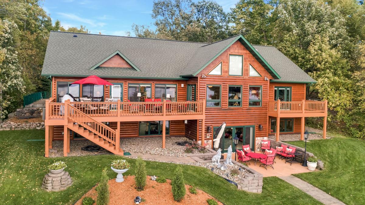 Dream Cabins Luxury home with sandy beach on Big Trout Lake listed at