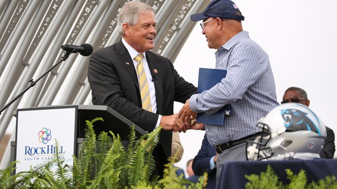 South Carolina Gov. Henry McMaster puts on a Carolina Panthers hat