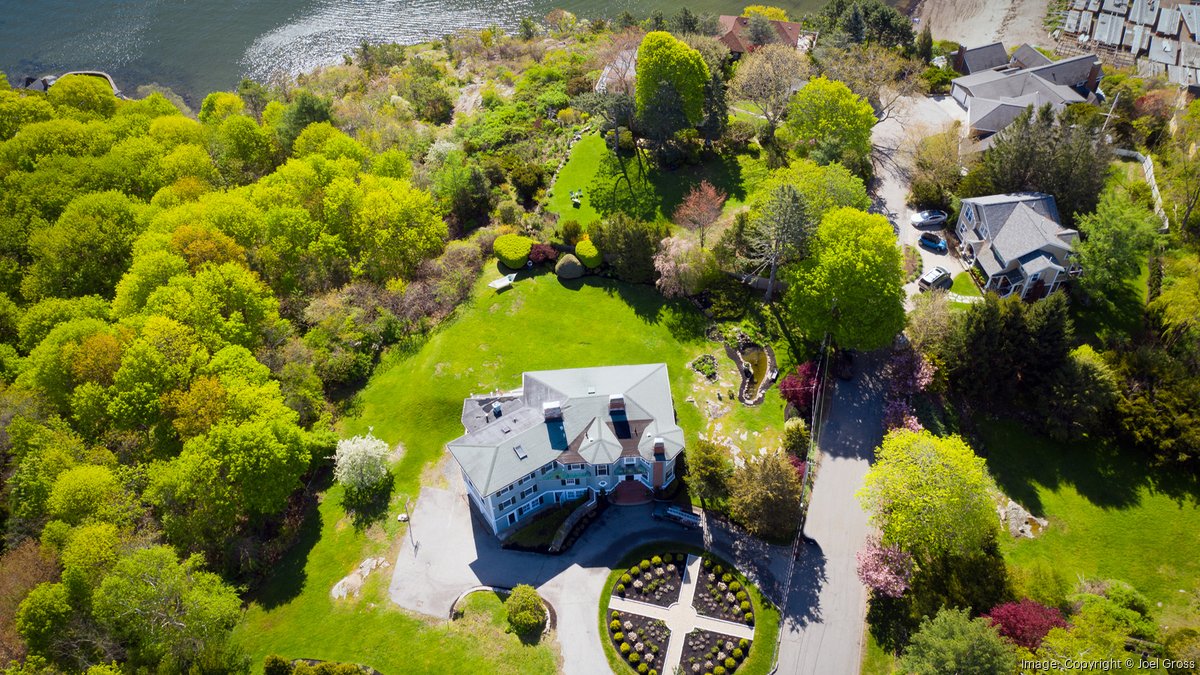 This waterfront Marblehead property has a koi pond and wine cellar