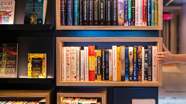 A wall with bookshelves pivots to reveal a secret green room at Macmillan Publishers in New York, Aug. 9, 2019. (Jeenah Moon/The New York Times)