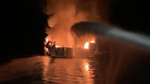 In a photo from the Ventura County Fire Department, firefighters respond to a scuba diving boat fire just off Santa Cruz Island in Southern California early Monday, Sept. 2, 2019. The U.S. Coast Guard is searching for more than 30 people after the boat caught fire early Monday morning, according to a spokeswoman. (Ventura County Fire Department via The New York Times) -- FOR EDITORIAL USE ONLY