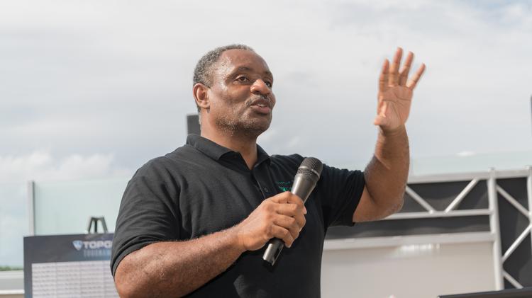 Tony Thompson of Kwame Building Group speaking at the Kwame Foundation's annual golf tournament in 2019.