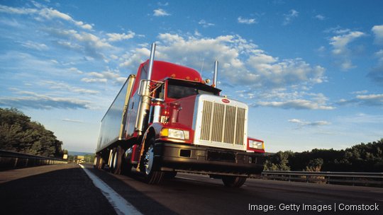 Semi truck barreling down highway