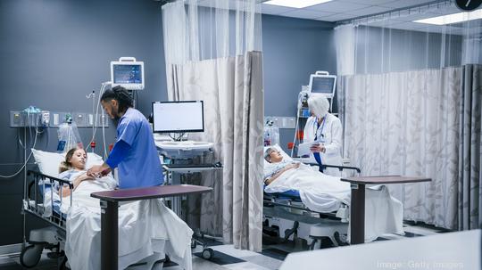 Doctor and nurse with patients in hospital