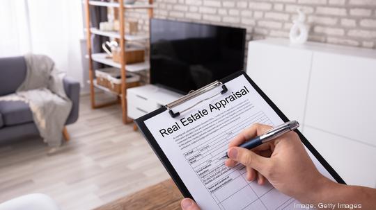 Man Filling Real Estate Appraisal Form