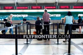 Frontier faces class-action lawsuit over 'hidden' carry-on fees