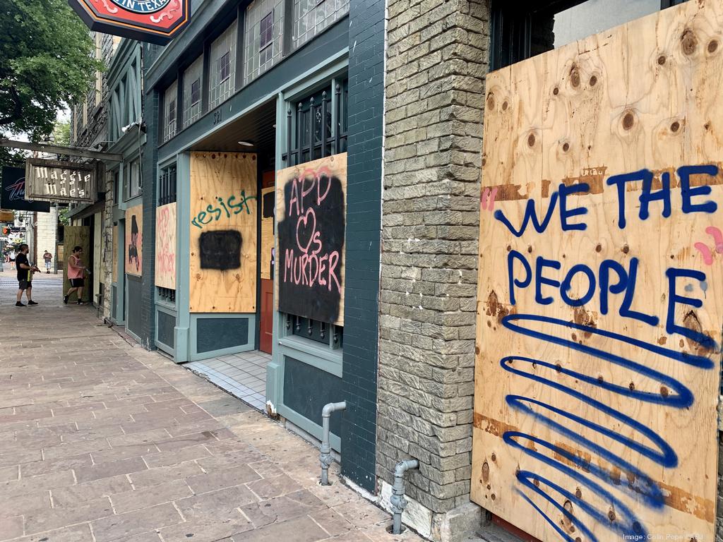 The Domain storefronts boarded up after reports of looting in