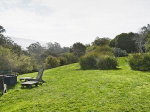 Chairs around fire pit at farmhouse