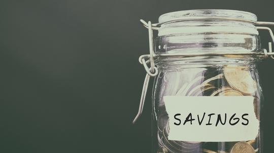 Coins in Jar With Text Savings