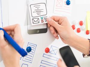 Designer drawing website ux app development.