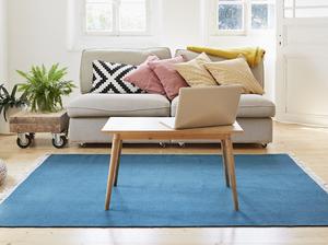 Laptop on coffee table in a modern living room of an old country house