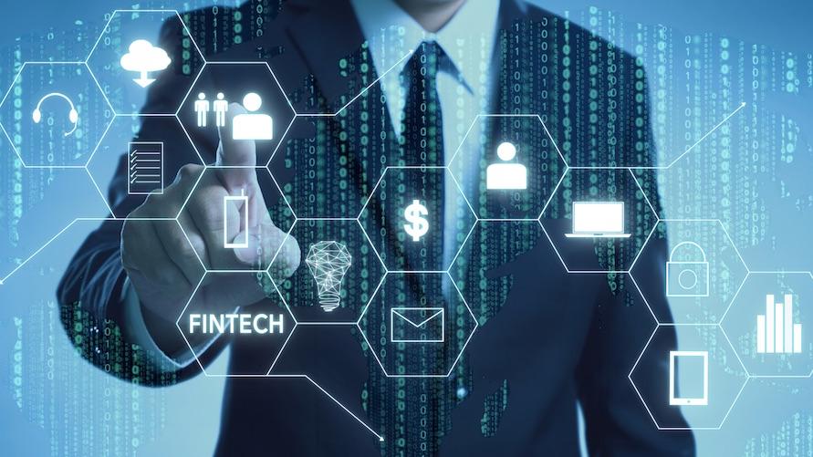 Image: Businessman with fintech icon and internet of things with matrix code background, Investment and financial internet technology concept. Credits: jamesteohart via Getty Images.