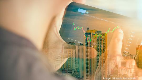 a man checking stock market