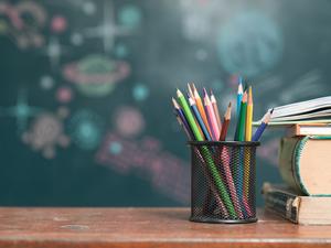 School books on desk, education concept