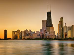 View Of City At Waterfront During Sunset