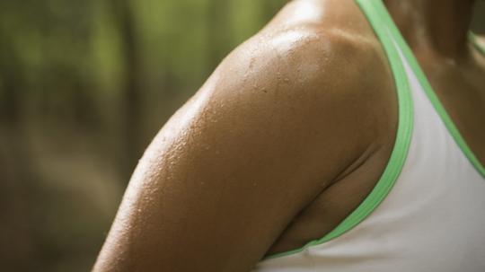 Woman stretching, close-up