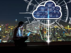 Business success and technology concept, Asian businessman sitting and using the laptop and working with virtual screen connecting with cloud technology over the cityscape background at night time