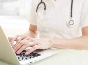 Nurse using a laptop computer.