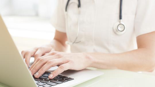 Nurse using a laptop computer.