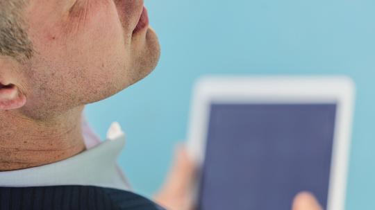 Caucasian businessman using digital tablet