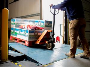 Fm employee loading a pallet for delivery