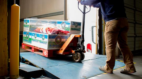 Fm employee loading a pallet for delivery