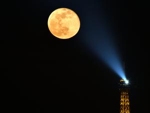 Full moon next to Eiffel Tower