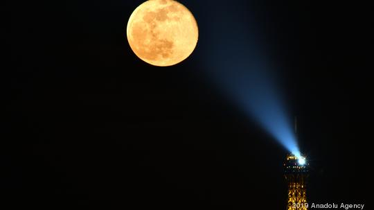 Full moon next to Eiffel Tower