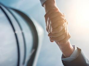 Close-Up Of Hands Against Sky