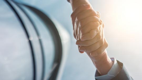 Close-Up Of Hands Against Sky