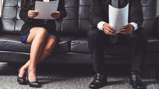 Stressed businessman and businesswoman candidate sit and wait for interview at the company office. Job application, business recruitment and Asian labor hiring concept.