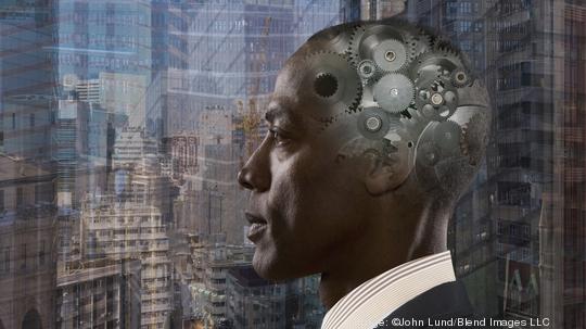 Mixed race businessman with gears in head