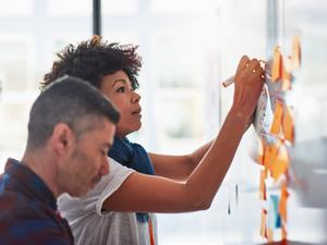 Colleagues brainstorming in a tech start-up office