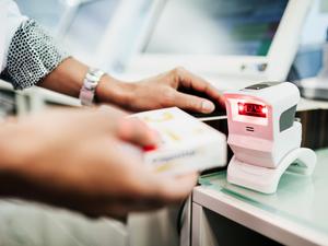 Pharmacist Scanning Pill Packet