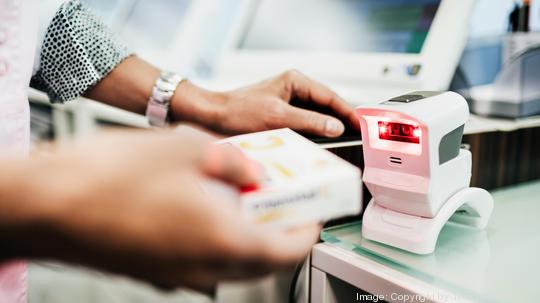 Pharmacist Scanning Pill Packet