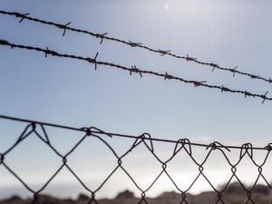 barbed wire fence on street