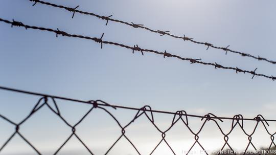 barbed wire fence on street