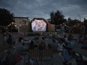 Crowd watching movie in the park