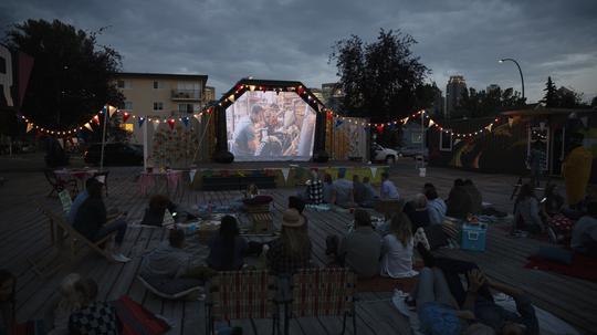 Crowd watching movie in the park